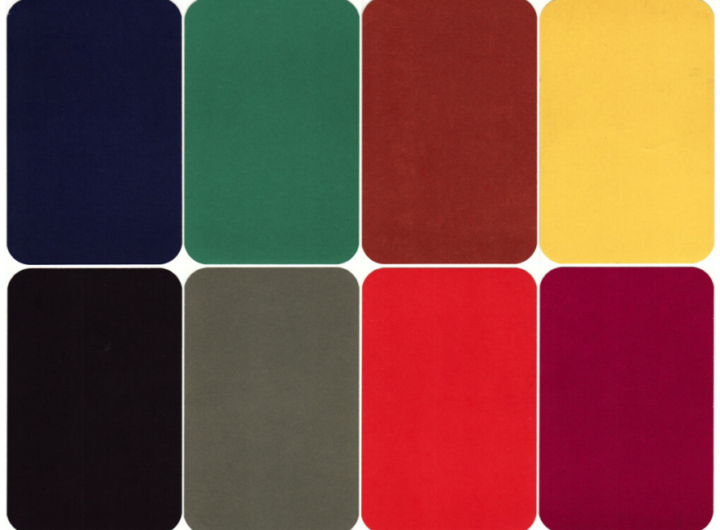 Eight Luscher Color Test cards arranged in two rows of four, showing blocks of dark red, bright red, grey, black, yellow, brown, green, and dark blue