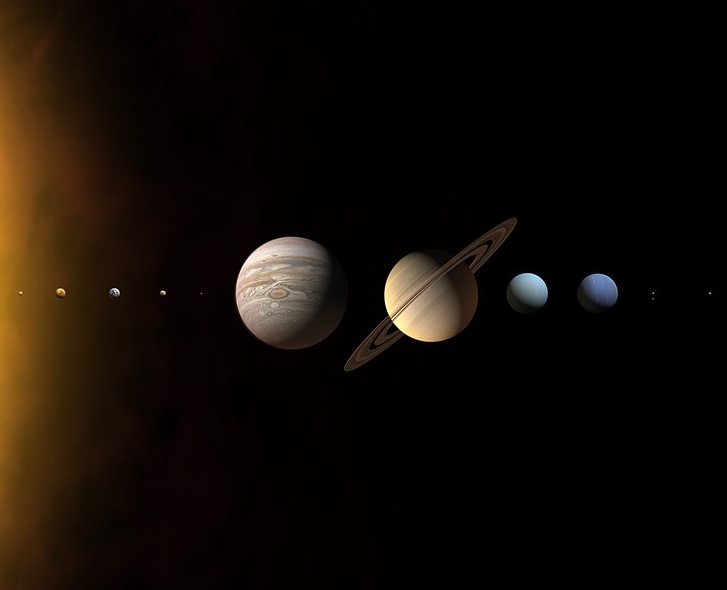 An illustration of the solar system planets lined up by distance from the Sun against a black space background, highlighting Jupiter and Saturn.